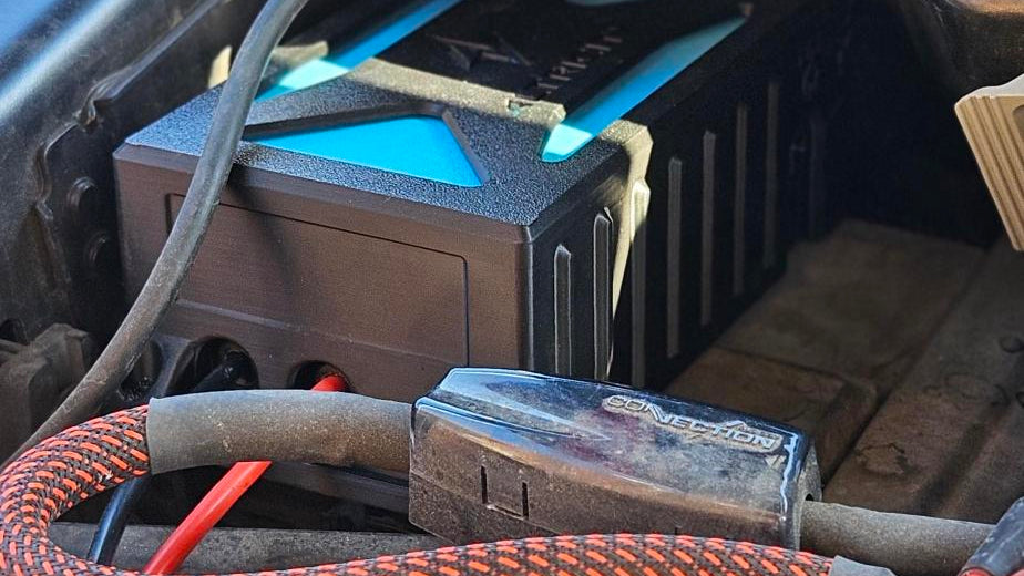 Altricity remote jump starter module installed in a Ford F-150 engine bay, wired to the 12-volt battery